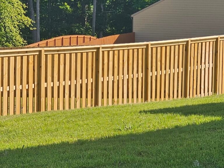 Wood privacy fence installation in a Georgia back yard