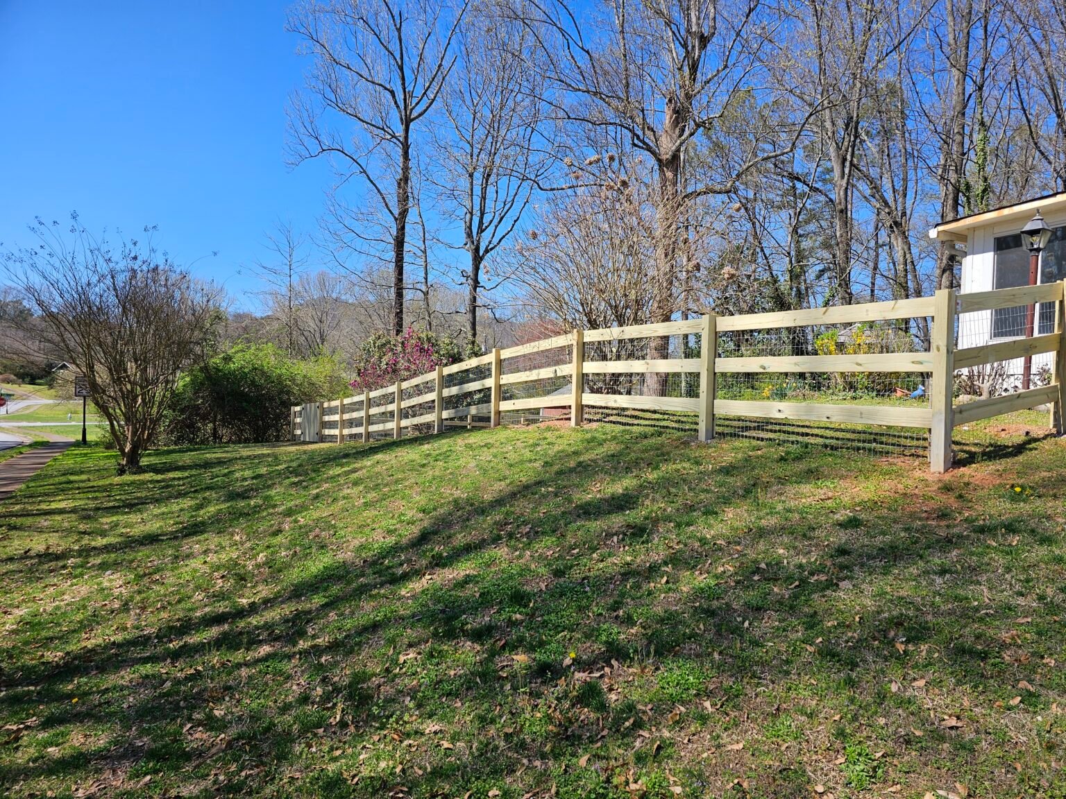 Three-rail ranch fence in Marietta, Georgia