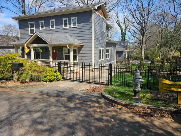 Four foot spear-top aluminum fence in front of a home in Atlanta, Georgia