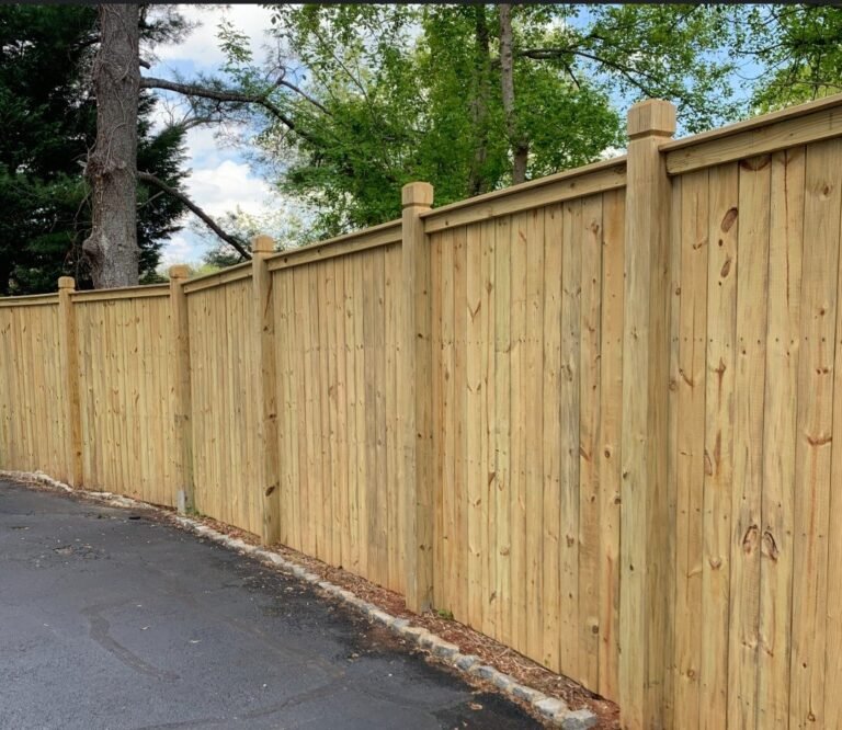 Capped privacy fence with dog-ear dado posts