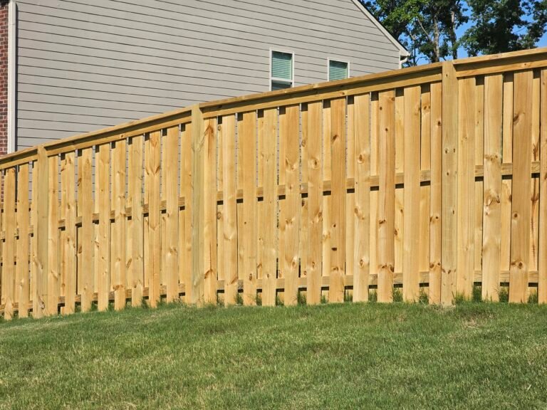 Capped wood shadowbox fence installed in Canton, Georgia