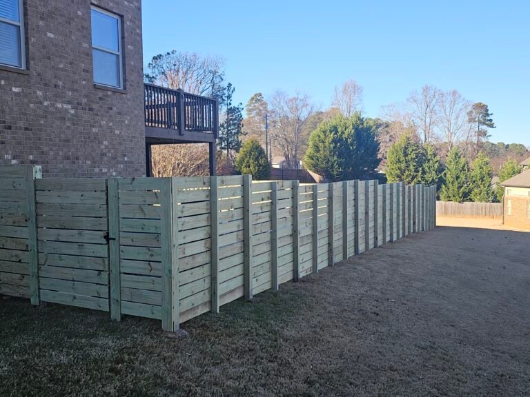 Horizontal spaced privacy fence in a back yard